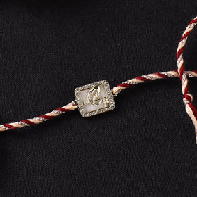 Handcrafted Kundan Rakhi for Brother with Potli 01