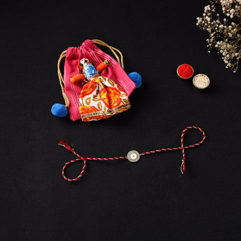Handcrafted Kundan Rakhi for Brother with Potli 02