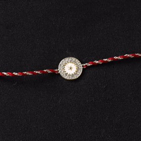 Handcrafted Kundan Rakhi for Brother with Potli 02