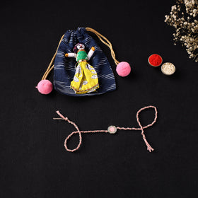 Handcrafted Kundan Rakhi for Brother with Potli 07