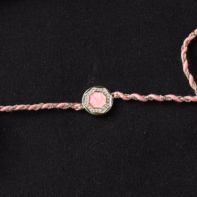 Handcrafted Kundan Rakhi for Brother with Potli 07