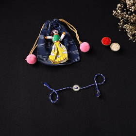 Handcrafted Kundan Rakhi for Brother with Potli 09