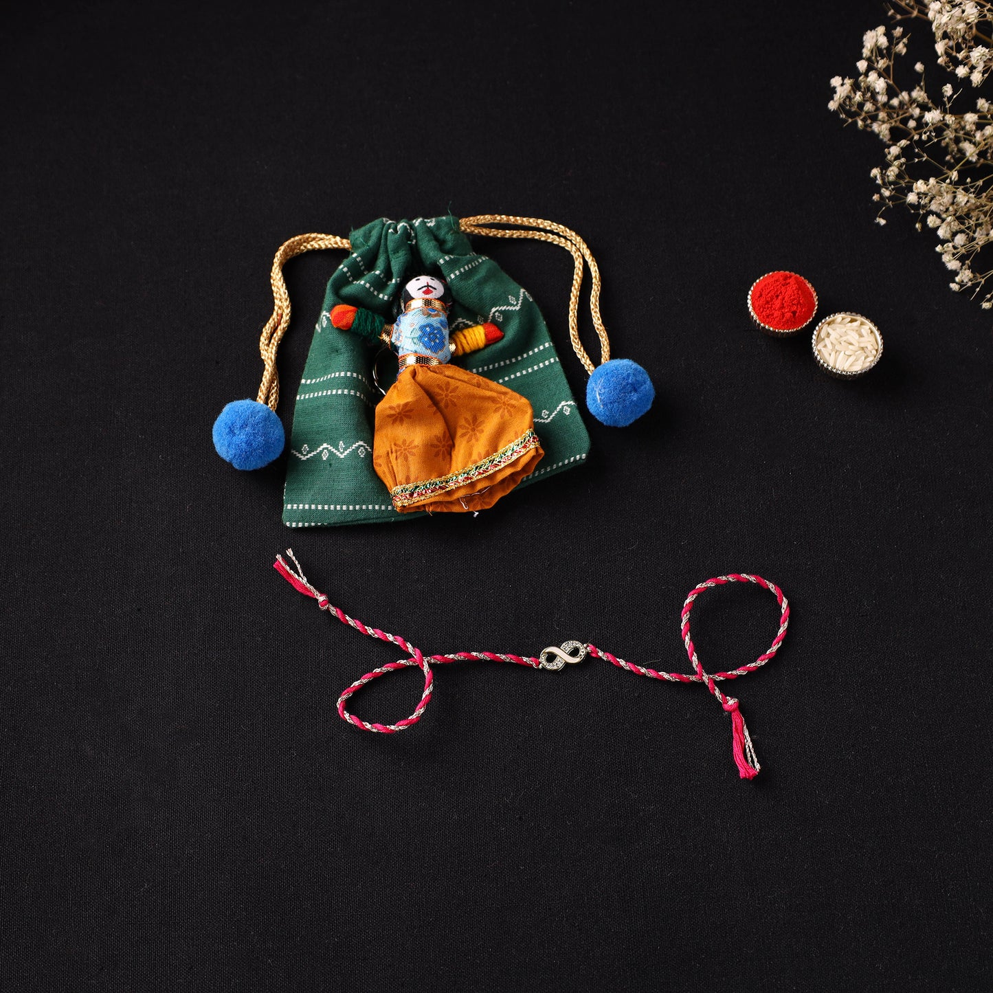 Handcrafted Kundan Rakhi for Brother with Potli 11