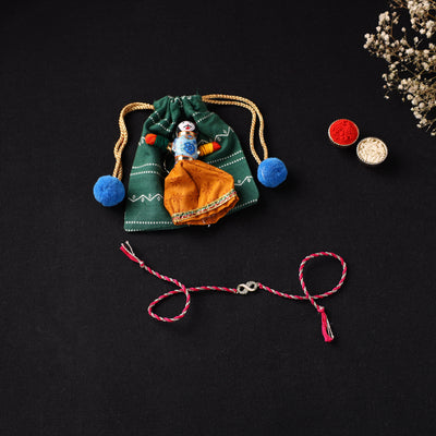 Handcrafted Kundan Rakhi for Brother with Potli 11
