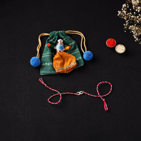 Handcrafted Kundan Rakhi for Brother with Potli 11