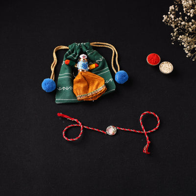 Handcrafted Kundan Rakhi for Brother with Potli 12