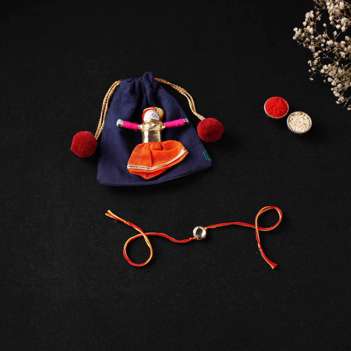 Handcrafted Kundan Rakhi for Brother with Potli 17