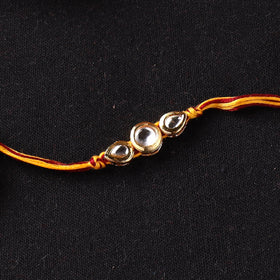 Handcrafted Kundan Rakhi for Brother with Potli 27