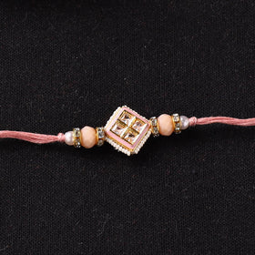 Handcrafted Kundan Beaded Rakhi for Brother with Potli 37