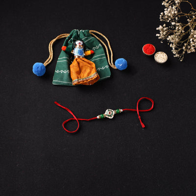 Handcrafted Kundan Beaded Rakhi for Brother with Potli 38
