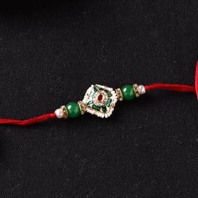 Handcrafted Kundan Beaded Rakhi for Brother with Potli 38