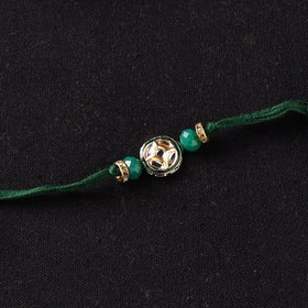 Handcrafted Kundan Beaded Rakhi for Brother with Potli 43