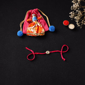 Handcrafted Kundan Beaded Rakhi for Brother with Potli 45