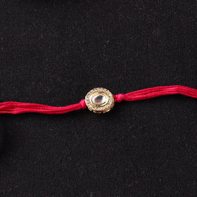Handcrafted Kundan Beaded Rakhi for Brother with Potli 45