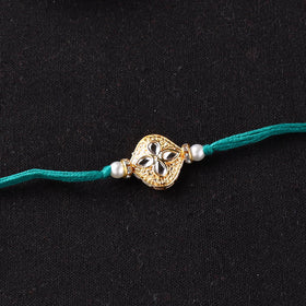 Handcrafted Kundan Beaded Rakhi for Brother with Potli 47