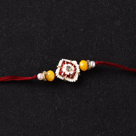 Handcrafted Kundan Beaded Rakhi for Brother with Potli 48
