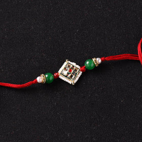 Handcrafted Kundan Beaded Rakhi for Brother with Potli 49