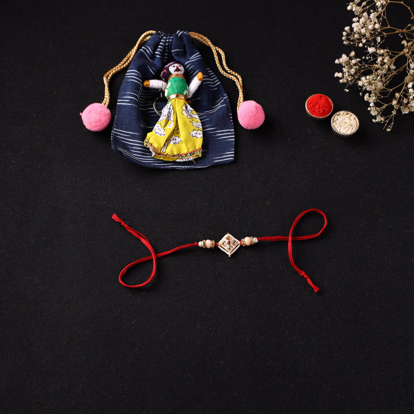 Handcrafted Kundan Beaded Rakhi for Brother with Potli 50