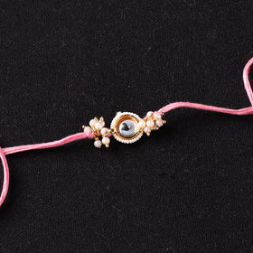 Handcrafted Kundan Beaded Rakhi for Brother with Potli 51