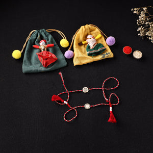 Handcrafted Kundan Bhaiya Bhabhi Rakhi Set with Potli 76