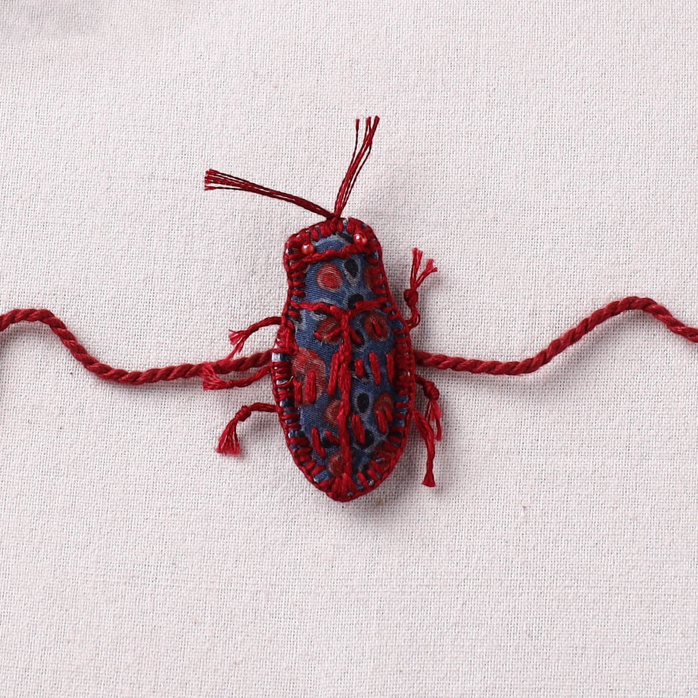 Cockroach - Reusable Handmade Threadwork Rakhi with Potli 07