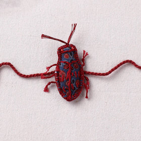 Cockroach - Reusable Handmade Threadwork Rakhi with Potli 07