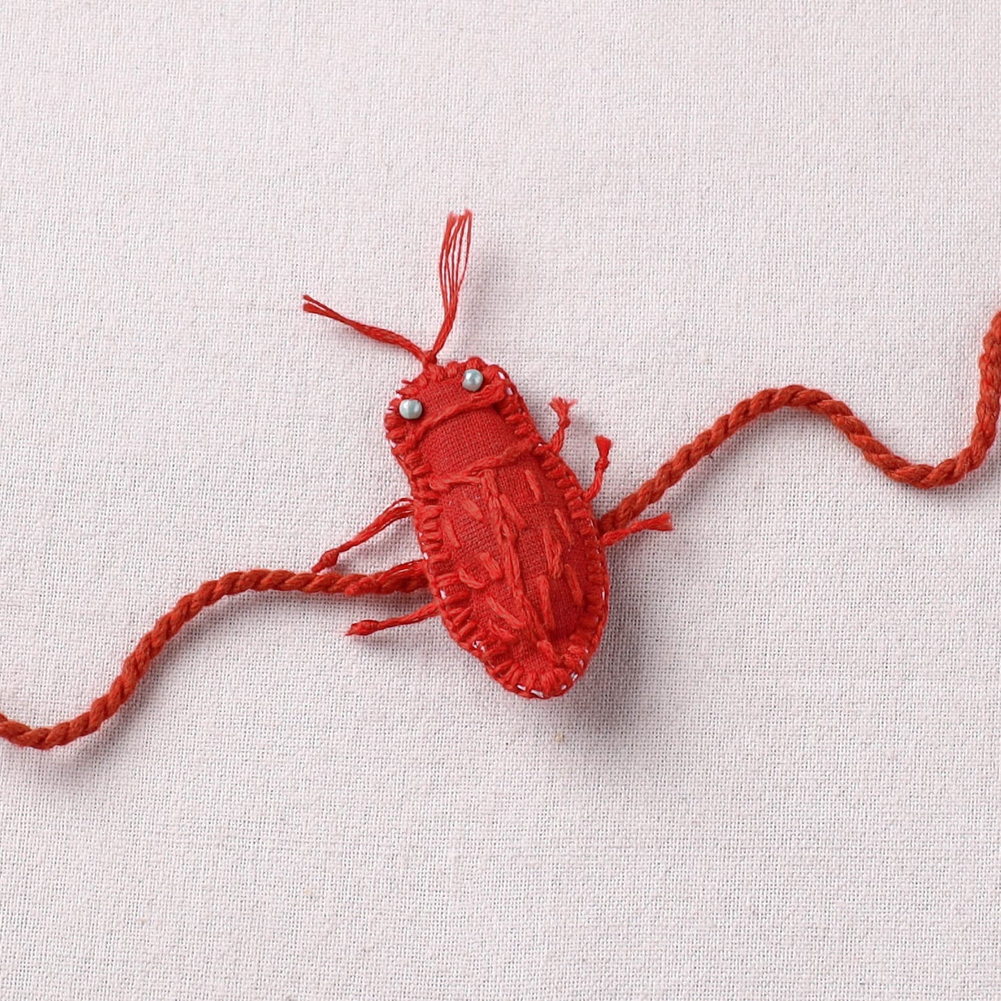 Cockroach - Reusable Handmade Threadwork Rakhi with Potli 01