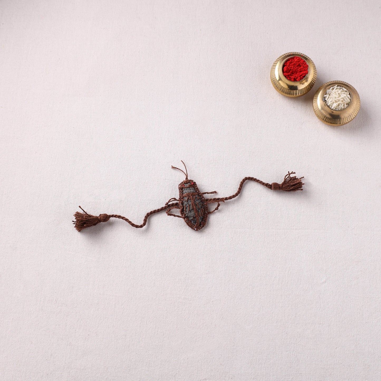 Cockroach - Reusable Handmade Threadwork Rakhi with Potli 02