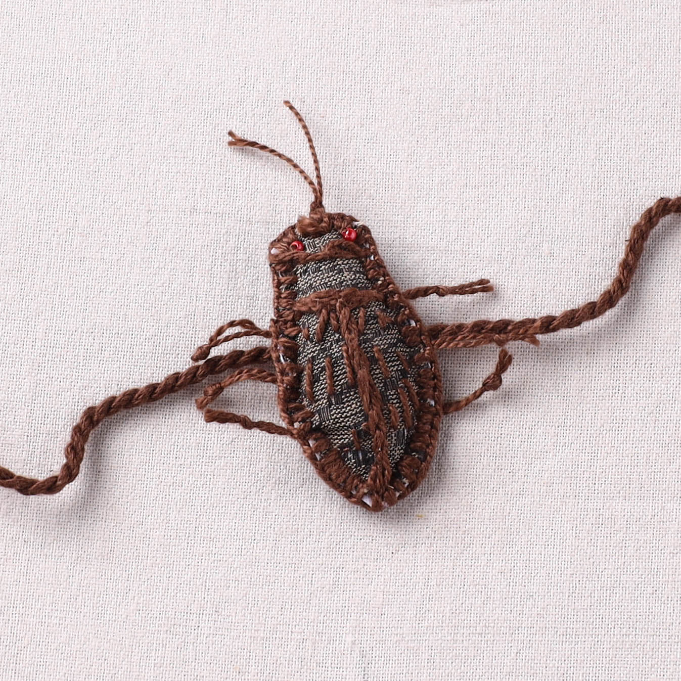 Cockroach - Reusable Handmade Threadwork Rakhi with Potli 02