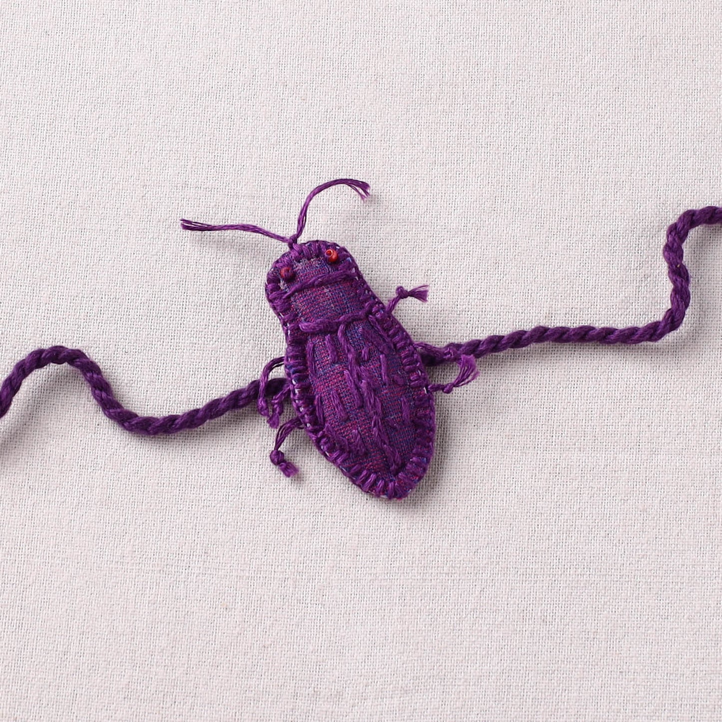 Cockroach - Reusable Handmade Threadwork Rakhi with Potli 04