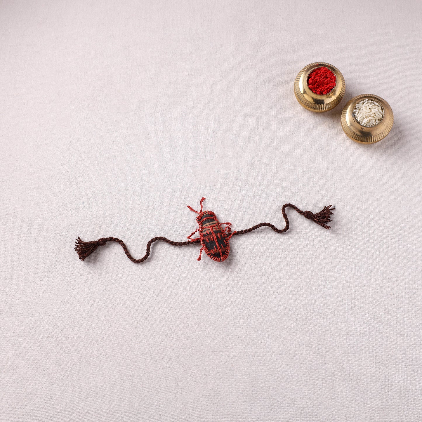 Cockroach - Reusable Handmade Threadwork Rakhi with Potli 05