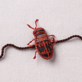 Cockroach - Reusable Handmade Threadwork Rakhi with Potli 05