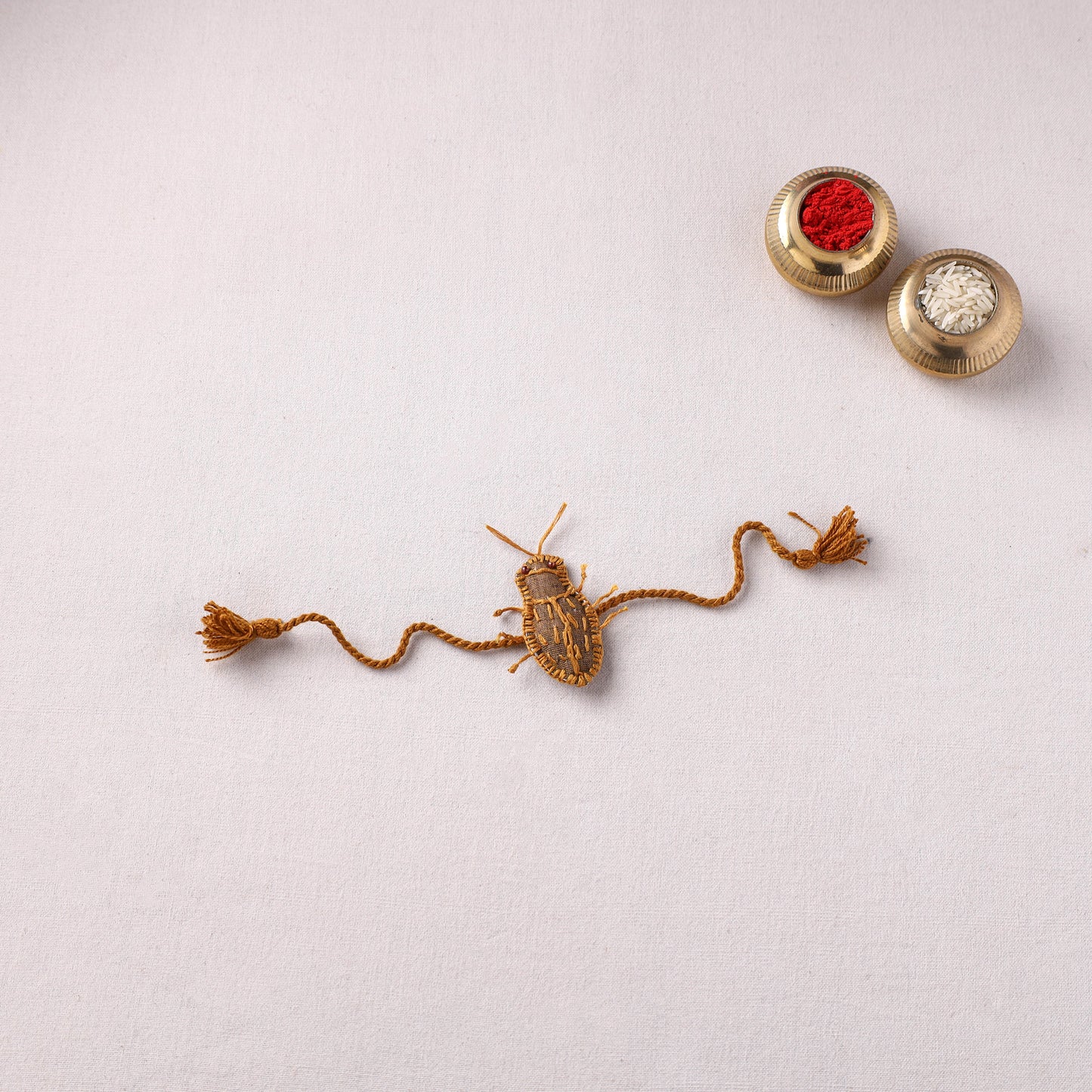 Cockroach - Reusable Handmade Threadwork Rakhi with Potli 06