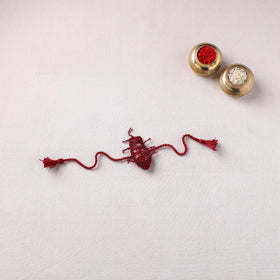Cockroach - Reusable Handmade Threadwork Rakhi with Potli 09