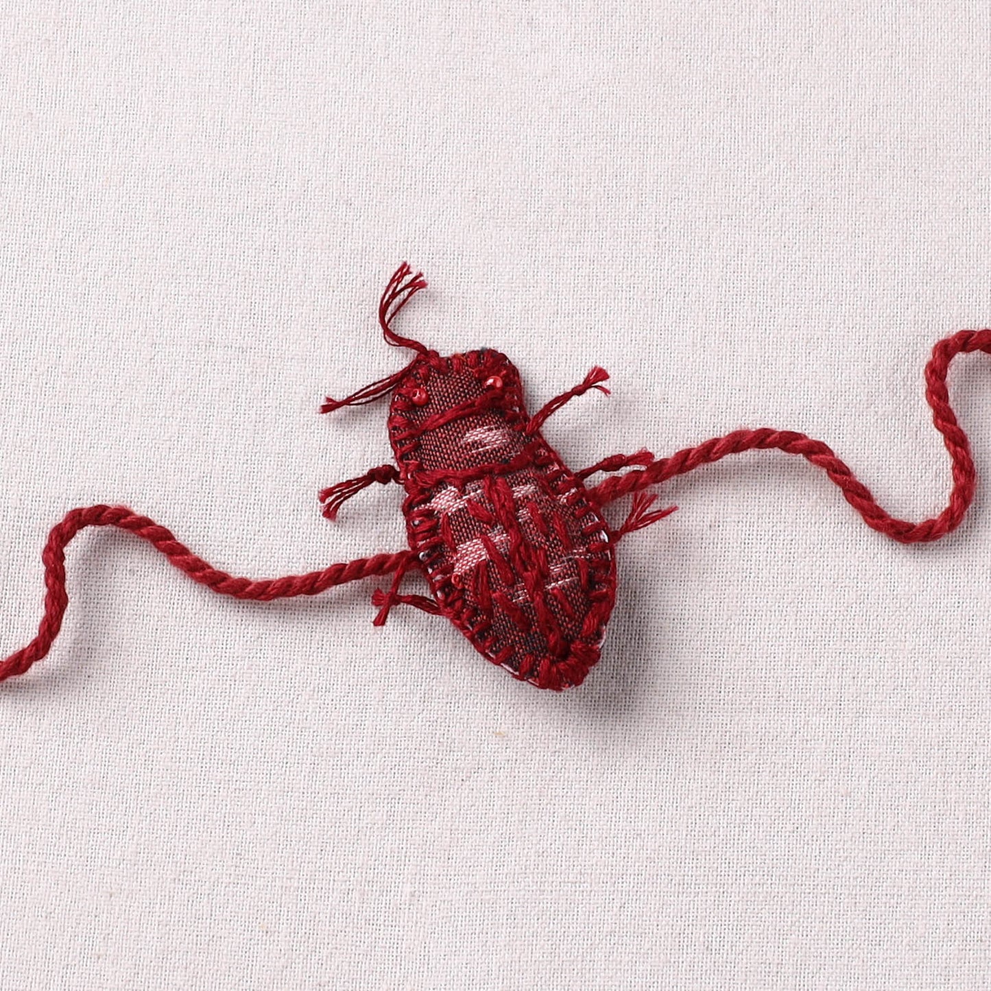 Cockroach - Reusable Handmade Threadwork Rakhi with Potli 09