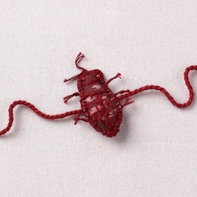 Cockroach - Reusable Handmade Threadwork Rakhi with Potli 09