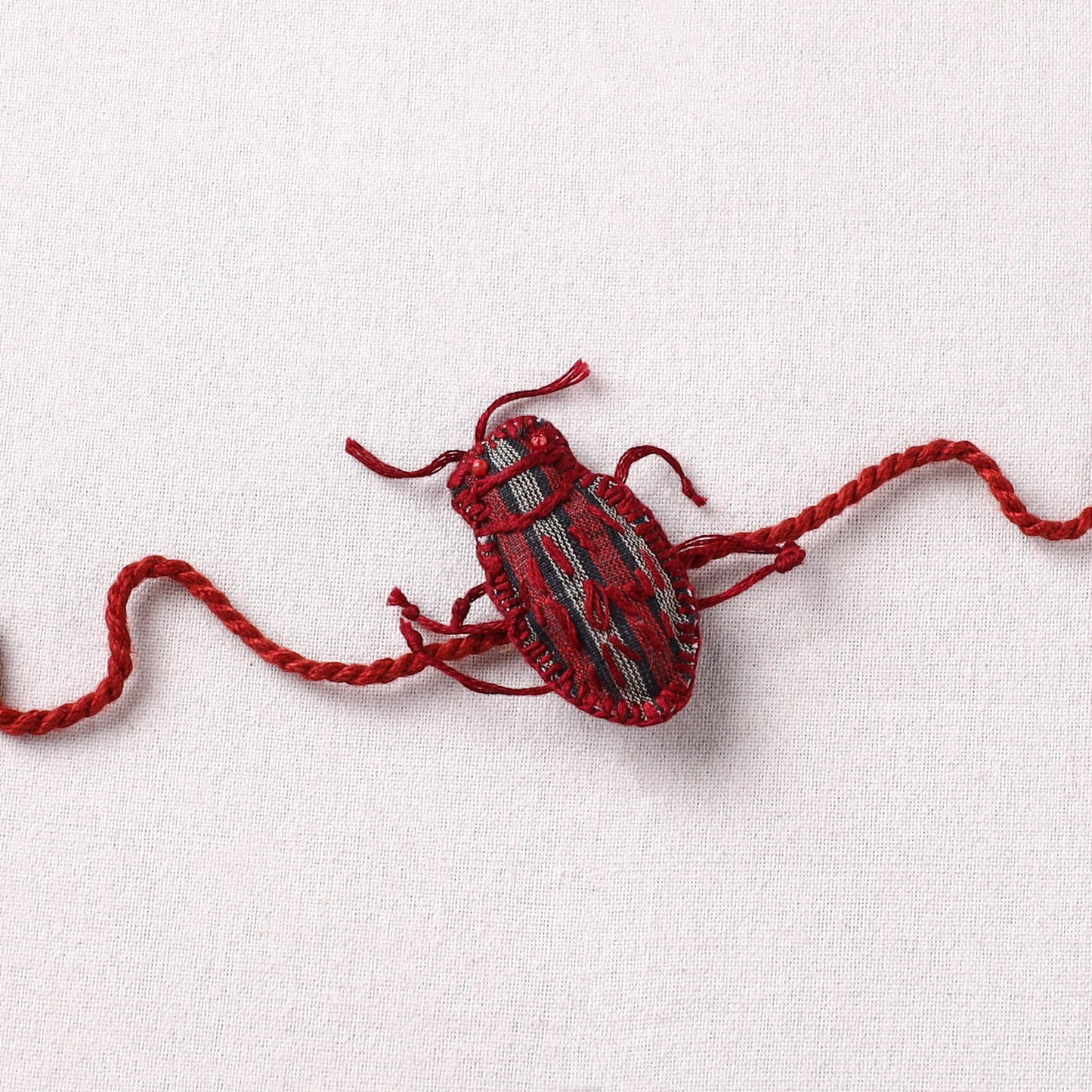 Cockroach - Reusable Handmade Threadwork Rakhi with Potli  10
