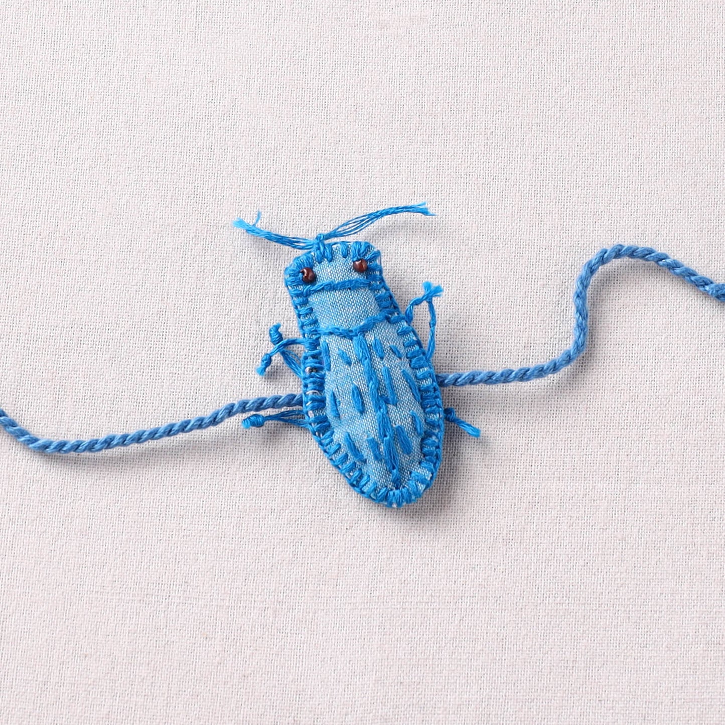 Cockroach - Reusable Handmade Threadwork Rakhi with Potli  11