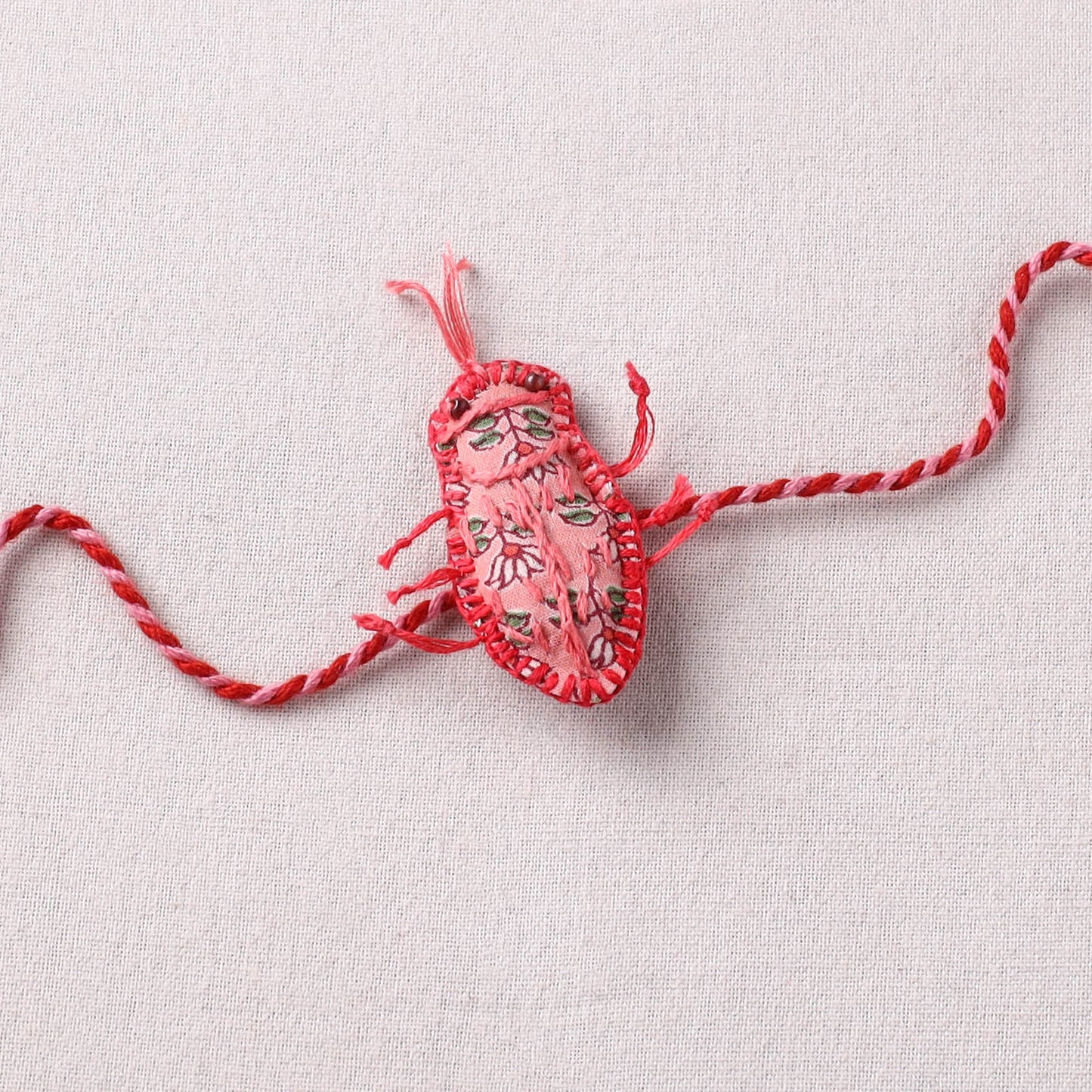 Cockroach - Reusable Handmade Threadwork Rakhi with Potli  12
