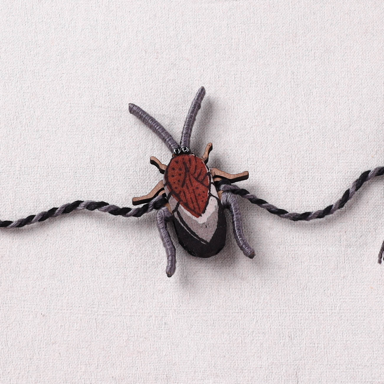 Cockroach - Reusable Handmade Threadwork Fabart Rakhi 01