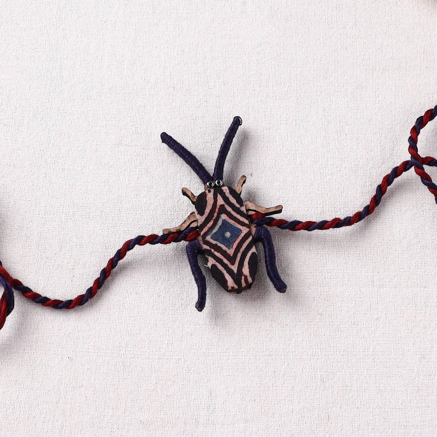 Cockroach - Reusable Handmade Threadwork Fabart Rakhi 06