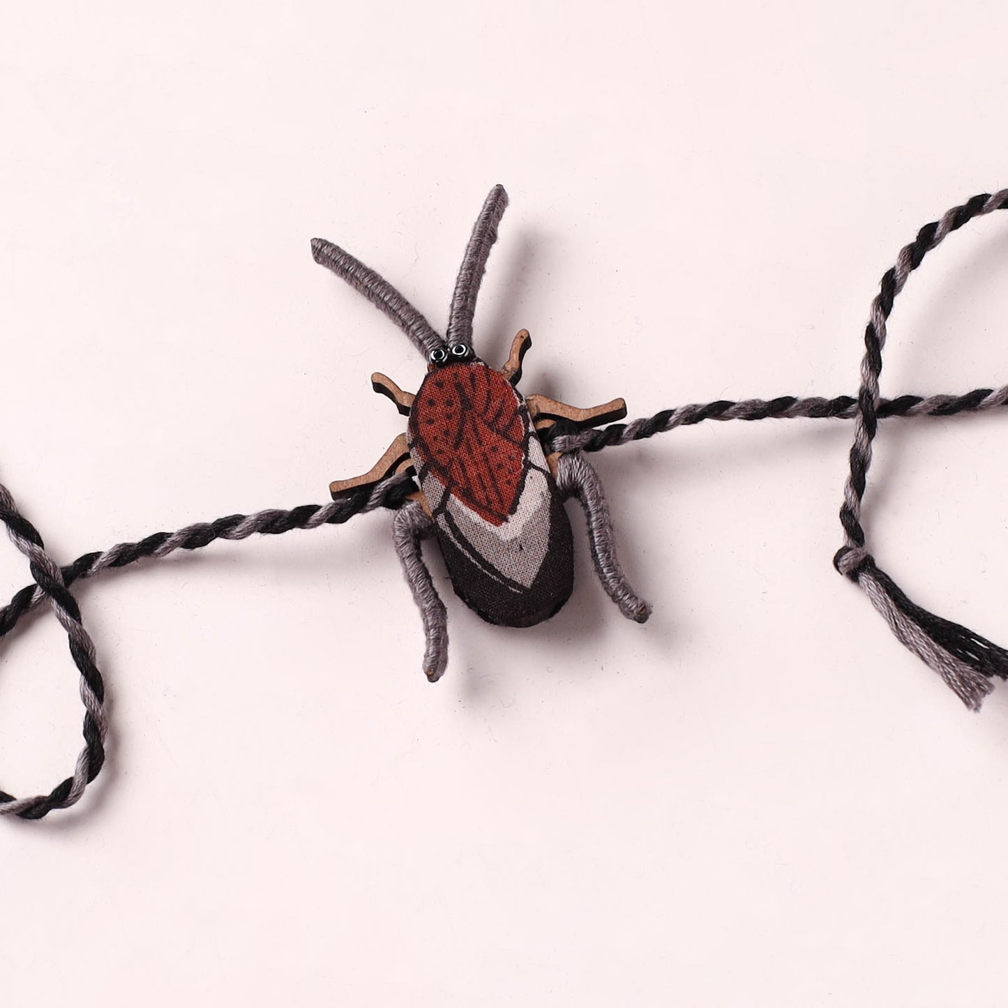 Cockroach - Reusable Handmade Threadwork Fabart Rakhi 01