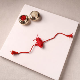 Cockroach - Reusable Handmade Threadwork Rakhi with Potli 01