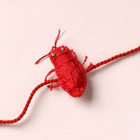 Cockroach - Reusable Handmade Threadwork Rakhi with Potli 01