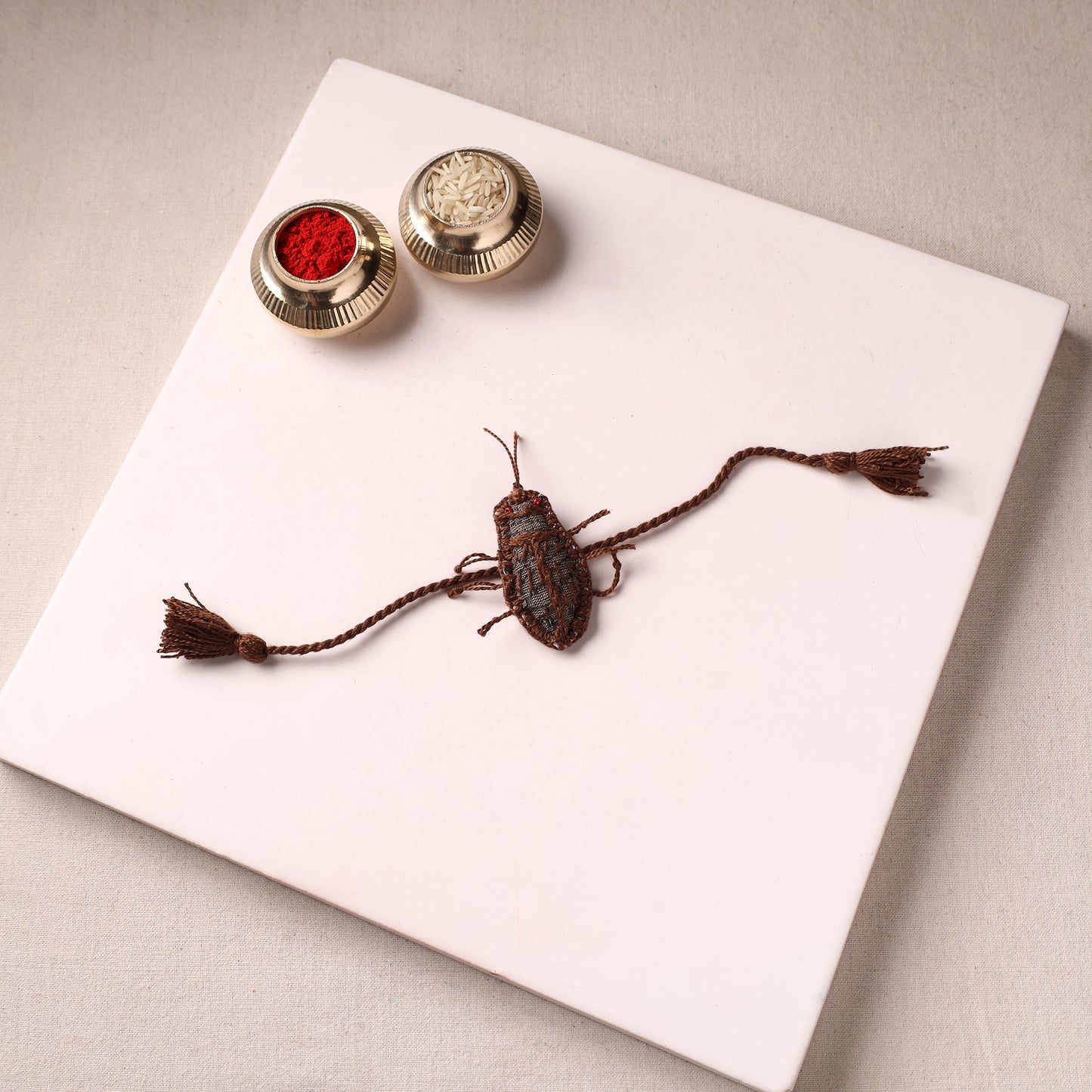 Cockroach - Reusable Handmade Threadwork Rakhi with Potli 02