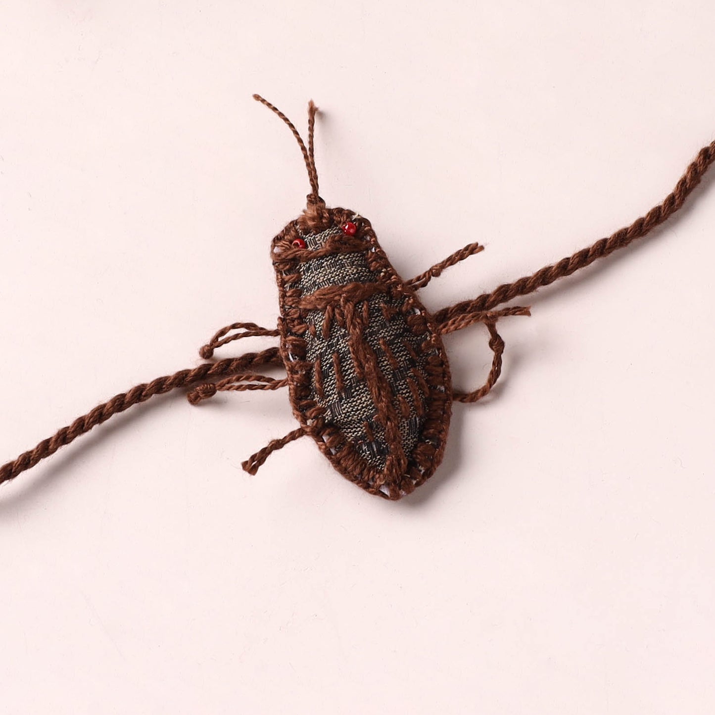 Cockroach - Reusable Handmade Threadwork Rakhi with Potli 02