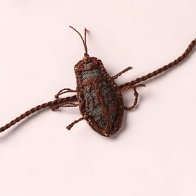 Cockroach - Reusable Handmade Threadwork Rakhi with Potli 02