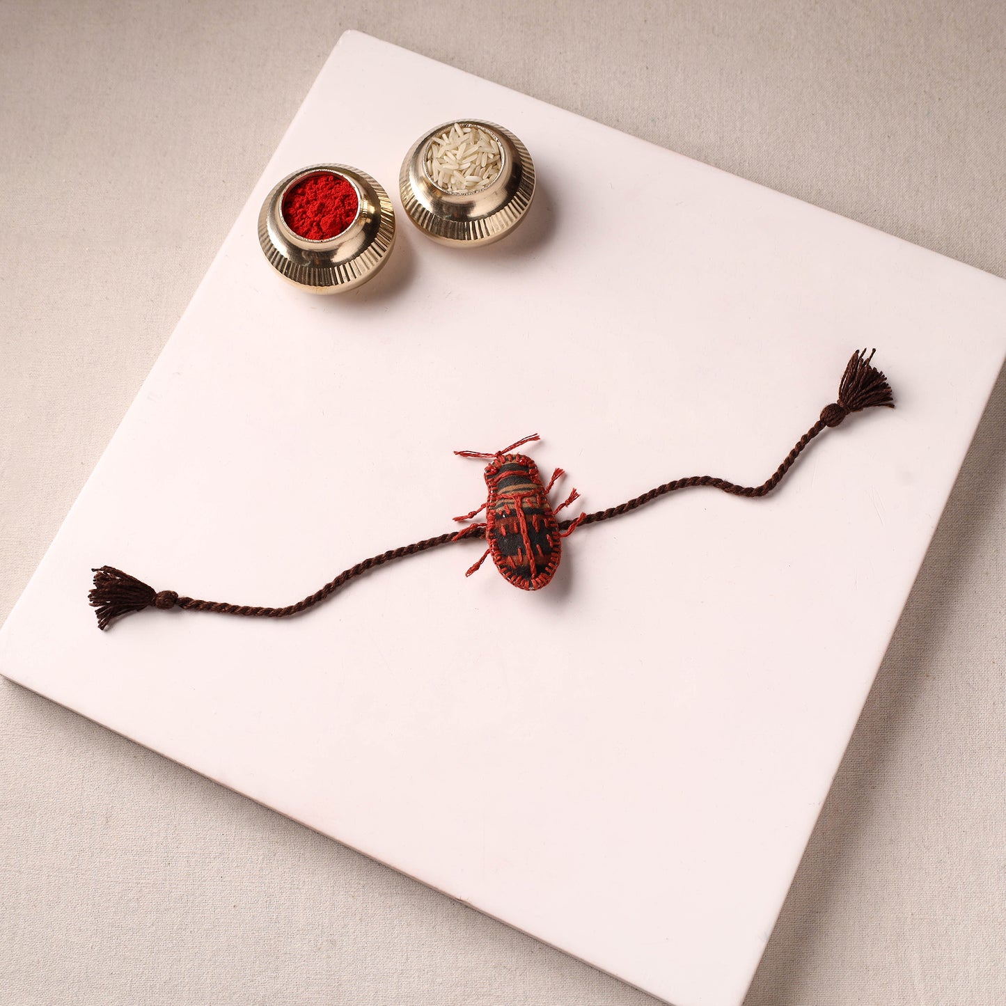 Cockroach - Reusable Handmade Threadwork Rakhi with Potli 05