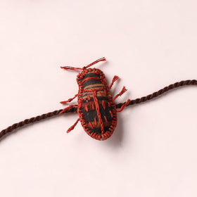 Cockroach - Reusable Handmade Threadwork Rakhi with Potli 05