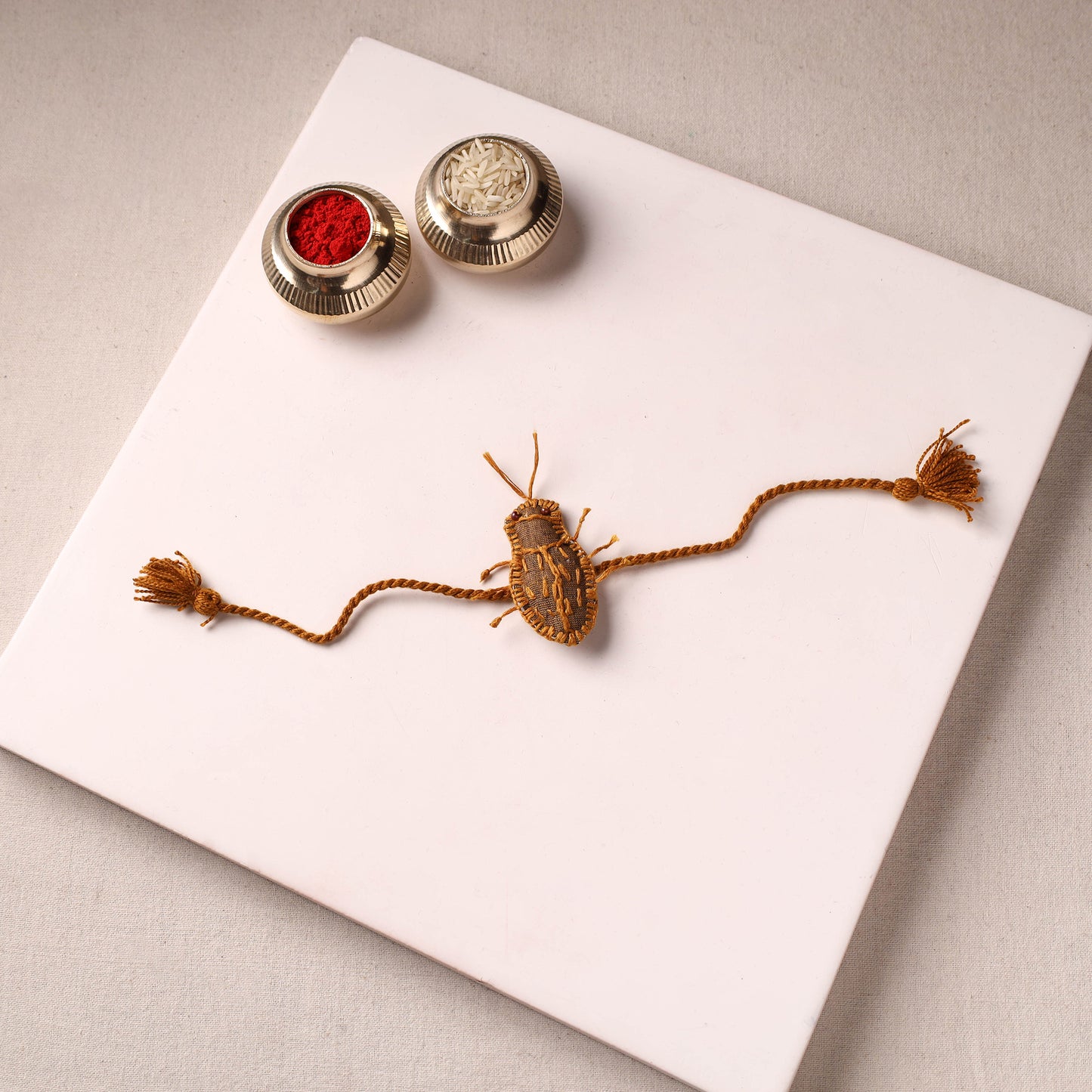 Cockroach - Reusable Handmade Threadwork Rakhi with Potli 06